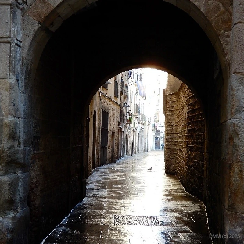 Drama filled dark archway in Spain, Europe on a cold rainy day photo